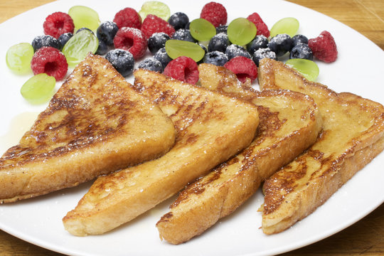  French toast - Photos French Toast with berries and honey for breakfast. Healthy breakfast.