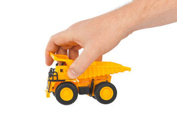 Fototapeta premium Toy car truck in hand