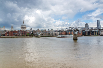 Fototapeta premium LONDON, ENGLAND - JUNE 15 2016: Panorama with St. Paul's Cathedral and Millennium bridge, London, England, Great Britain