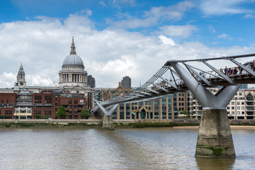 Fototapeta na wymiar LONDON, ENGLAND - JUNE 15 2016: St. Paul's Cathedral and Millennium bridge, London, England, Great Britain