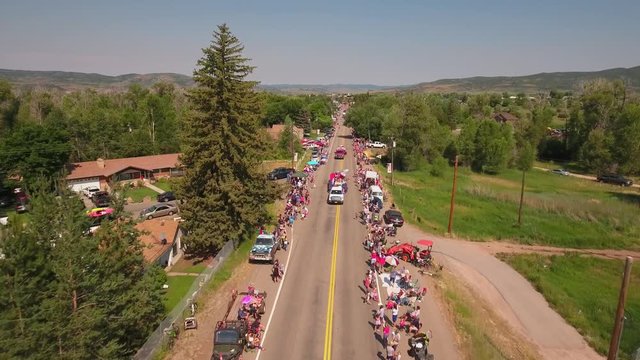 Aerial shot of crowds watching the small town parade in Utah