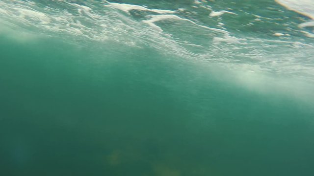 An underwater shot of bubbles passing by while in a boat