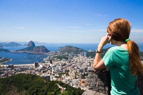 girl tourist looks at Rio landscape