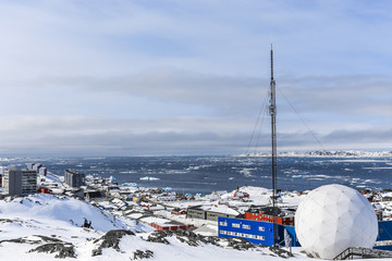 Snow covered city and fjord with icebergs overview, Nuuk © vadim.nefedov