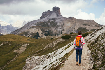 Naklejka na ściany i meble tourist girl at the Dolomites