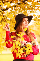 Charming woman walking in autumnal park