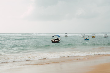 Fototapeta na wymiar Boats on stormy waves
