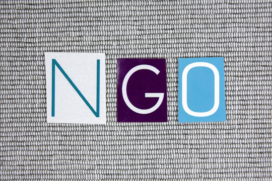 NGO (Non-Governmental Organization) acronym on grey background