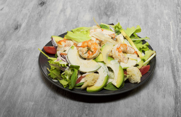 Caesar salad with prawns and avocado