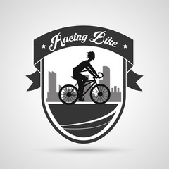 Man riding bike inside shield and ribbon icon. Healthy lifestyle racing ride and sport theme. Vector illustration