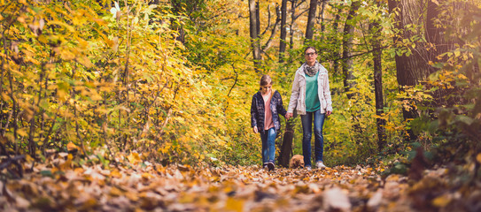 Mother and daughter hiking in a forest