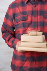 Man Wearing Flannel Shirt With Presents