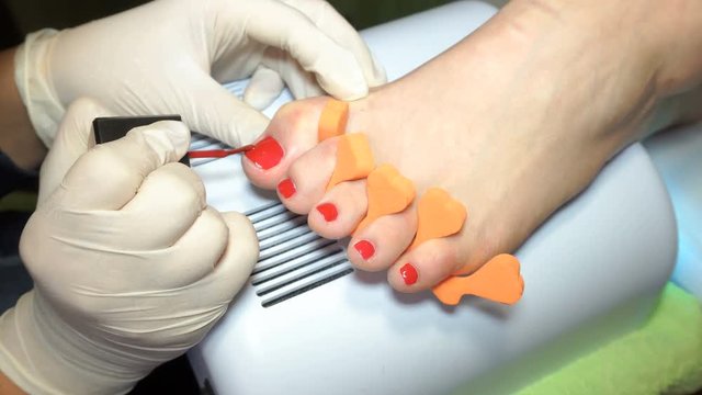 specialist beauty salon applying Polish nails
