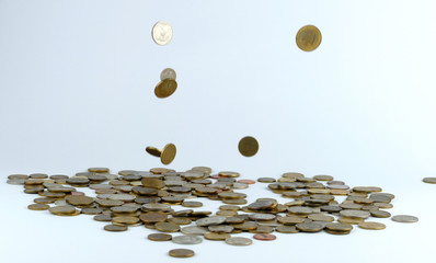 Coins fall into a pile