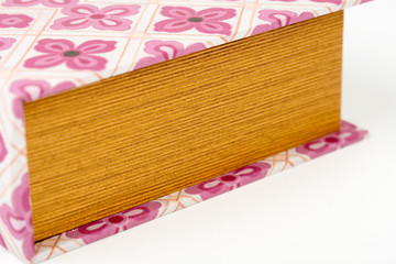 Decorative book - storage box, gift box. Old vintage boxes for storage on the bookshelf. Vintage ornaments. Shabby chic style. Retro. Isolated on white background. Closeup. 