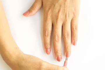 Nail polish in the woman hand.