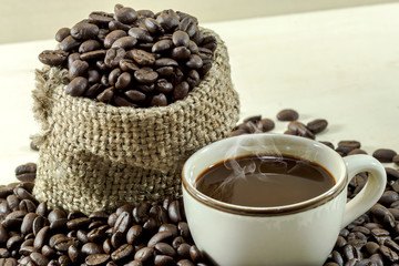 Roasted coffee beans and hot coffee