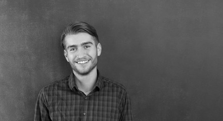 Fototapeta premium portrait of young startup businessman at modern office, chalkboa