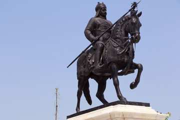 Life-sized bronze statue of Maharana Pratap at Maharana Pratap Memorial, Udaipur, Rajasthan balanced on his loyal and favorite horse, Chetak.