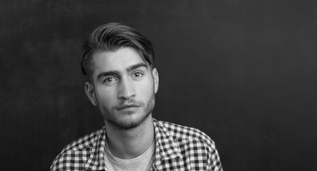 Young man in studio looking at camera