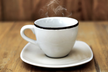 coffee cup on the wood.