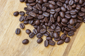 Hot coffee on the wood and roast coffee bean.