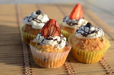 Attractive cream and berry decorated  cupcakes