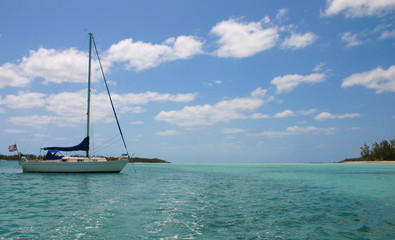 Sailboat in Paradise. A sailboat anchored in the Bahamian waters