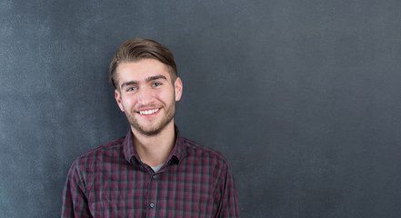Young man in studio looking at camera