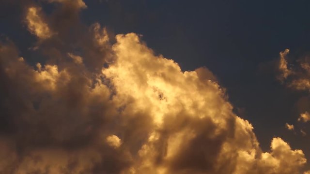 Closeup of orange cloud at dusk.