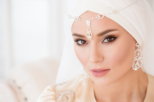 Portrait of a beautiful muslim bride in pink wedding dress