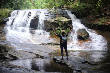 Man and Khao Cha Mao Waterfall in Rayong Thailand