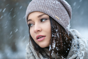 Beautiful young woman in wintertime outdoor