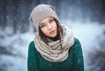 Beautiful young woman in wintertime outdoor