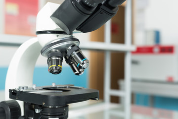 Scientist hands with microscope close-up shot in the laboratory