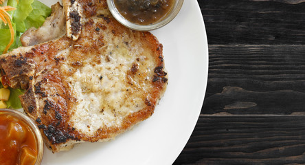 pork chops steak with black pepper sauce, tomato sauce, corn, ca