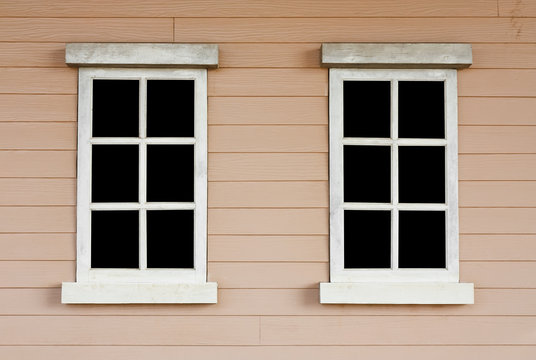 dual or two old wood white window with black screen on the wall