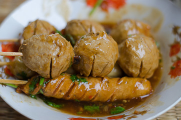 Fried meatballs on skewers close-up