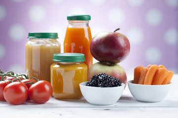 healthy ready-made baby food on a wooden table