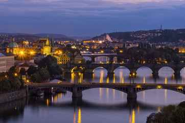 Fototapeta na wymiar Evening view on Charles bridge over Vltava river in Prague,capit