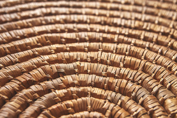 Circular background from natural brown rattan fibers