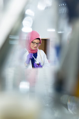 muslim lab worker with hijab or researcher doing an analysis in