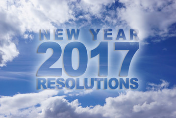 Word new year 2017 resolutions on blue sky with clouds