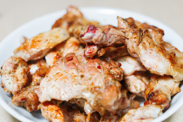 Grilled meat on a white plate