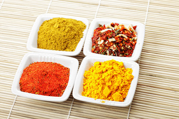 Obraz na płótnie Canvas Choice of spices on mat