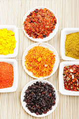 Spices in a rows on mat