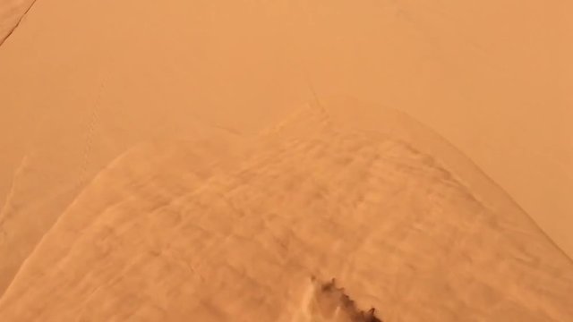 desert sand flows like water at North Africa Bechar Algeria, sandy Taghit desert