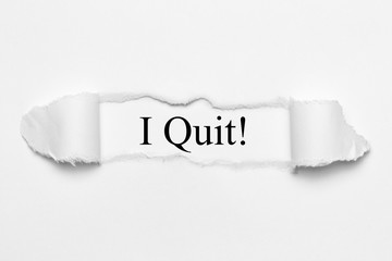 I Quit! on white torn paper