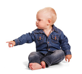 Cute little boy sitting with outstretched hand isolated .