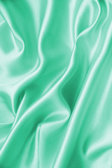Smooth elegant green silk as background